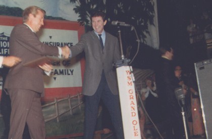 Fellow Capitol Records artist Buck Owens presenting Sonny with award at the Grand Ole Opry.